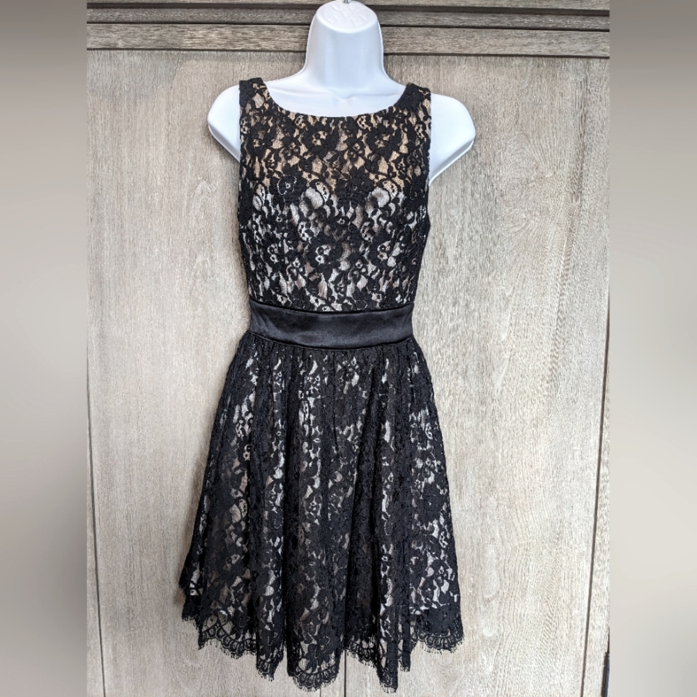 Bebe black lace A-line dress with tan underlay